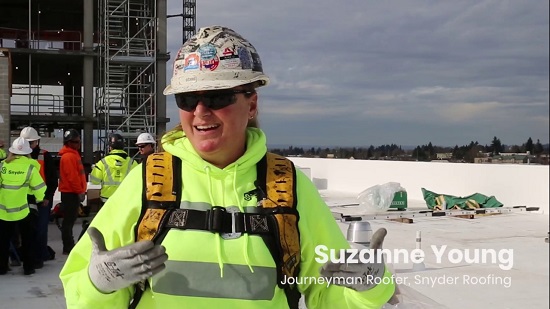 women in construction with properly fitting safety harnesses