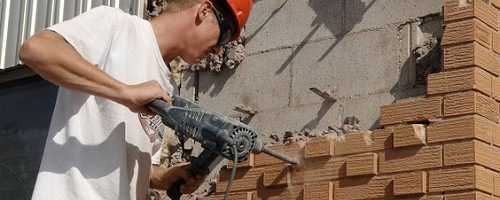 jackhammer to neighbour's retaining wall