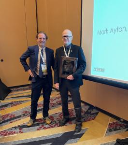 Mark Ayton accepts the Kenneth A. Stonex Roadside Safety Award alongside AKD20 Chair John Donahue in Washington, DC.