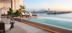View from Ela Residences balcony overlooking Dubai's Palm Jumeirah sea and cityscape