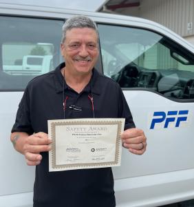 John Yant, Plastic Fusion Fabricators' plant manager/safety manager is holding the Safety Award certificate.